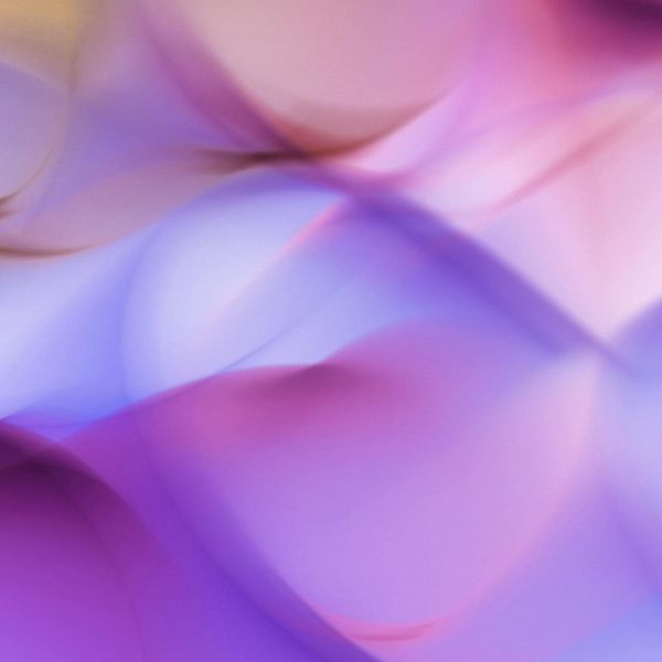 Abstract image representing flowing energy and vitality with soft amber colors.